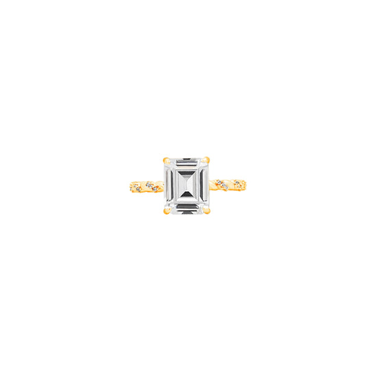 Twisted Band Emerald Cut Ring – Golden Weave Holding Timeless Clarity