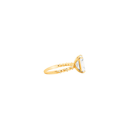 Twisted Band Emerald Cut Ring – Golden Weave Holding Timeless Clarity