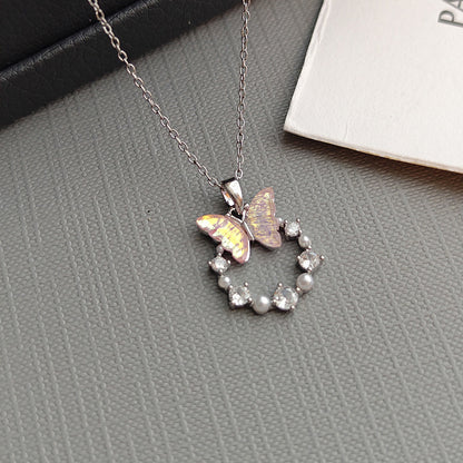 Butterfly & Pearl Circle Pendant – Graceful Sparkle for Your Neckline
